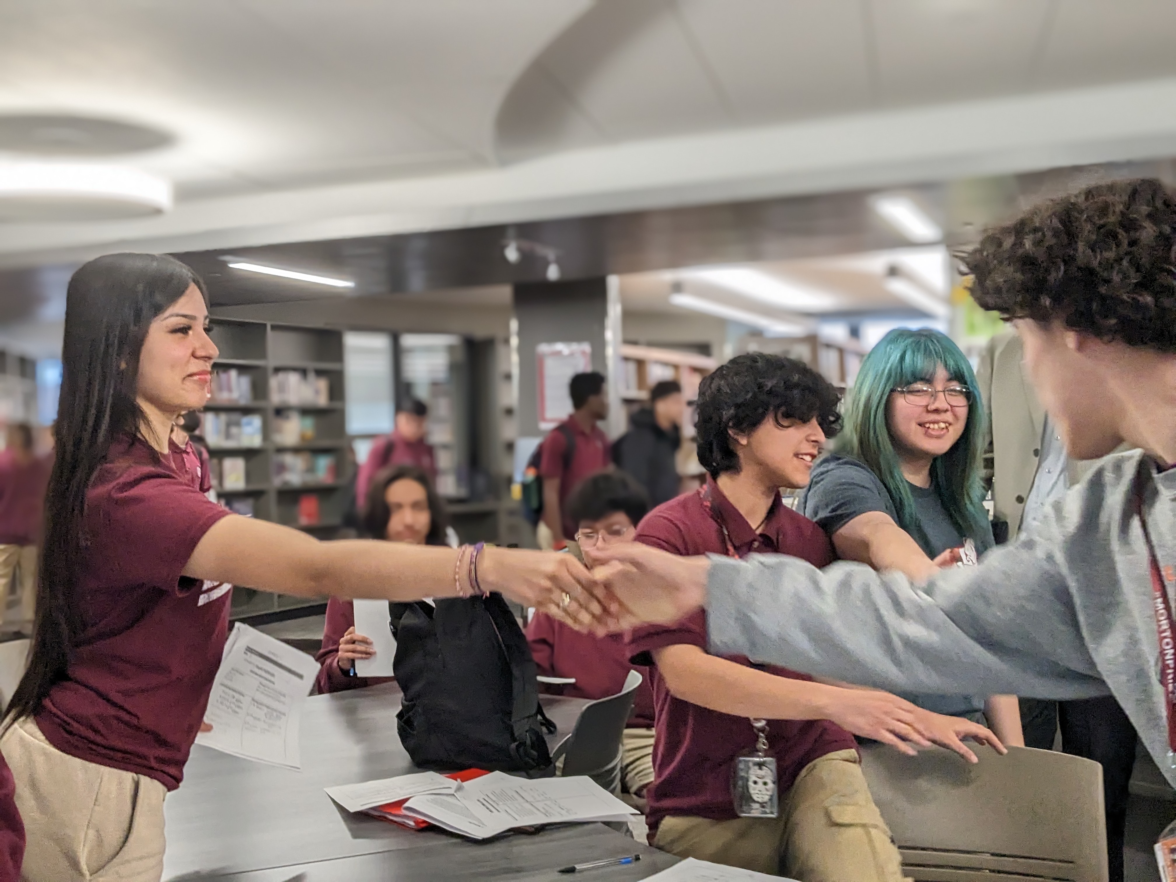 LEC members shaking hands at a community event