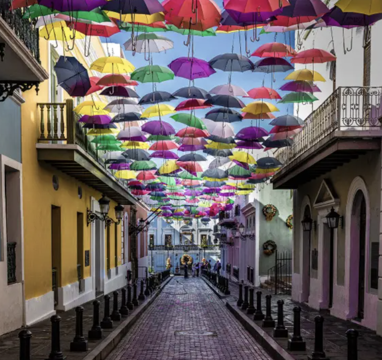 a street lined with colorful umbrellas in Puerto Rico